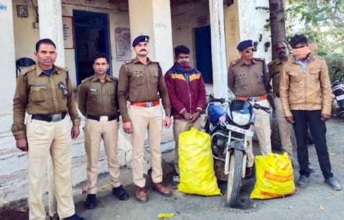 Seized 330 bottles of illegal liquor being transported on motorcycle